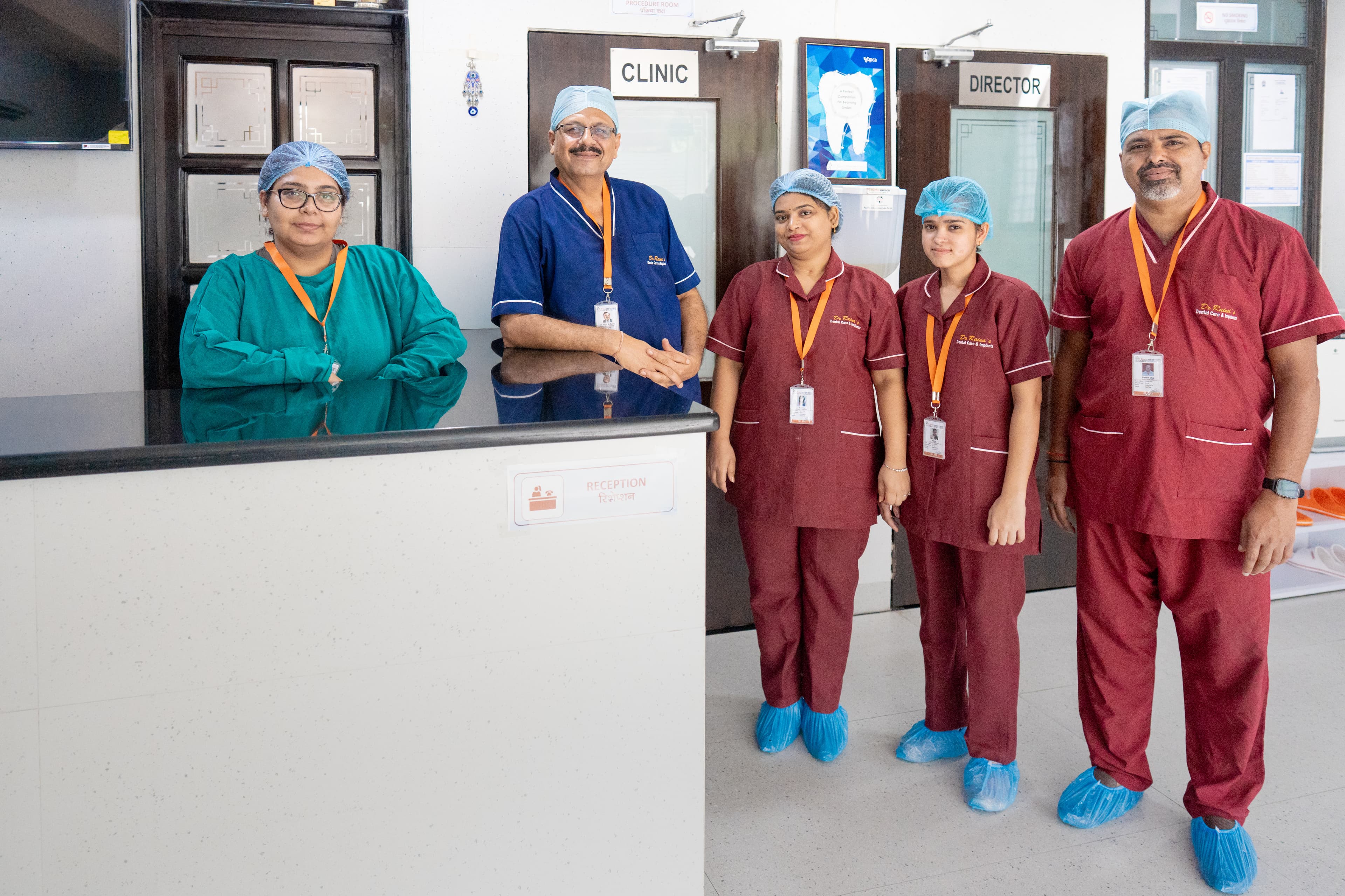 Dr. Raina's Dental Care & Implants team